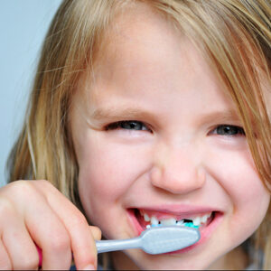 girl kid brushing her teeth