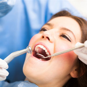 Dentist working in patients mouth